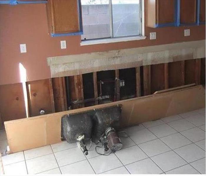 removed countertop and fixtures, showing exposed wall cavity