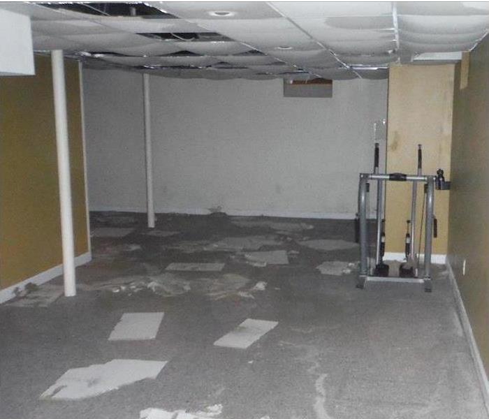water covering floor of storage area, soaked ceiling tiles