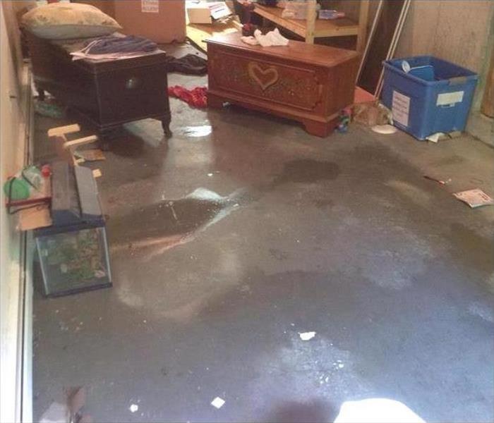 water on concrete pad, possessions thrown about the room 