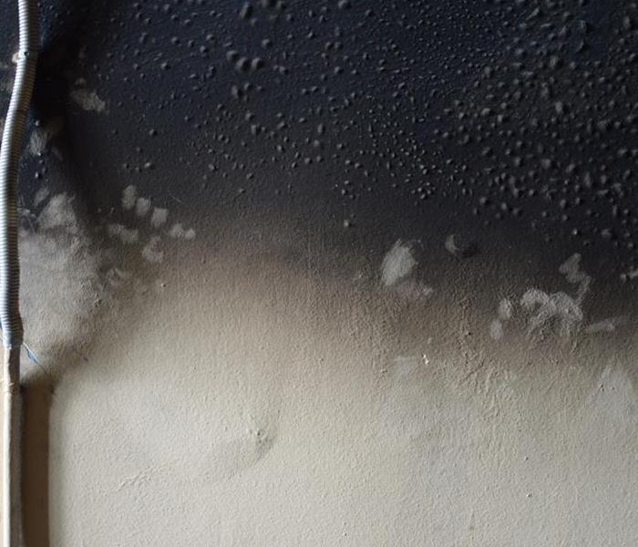 Smoke and fire damage on a wall. 