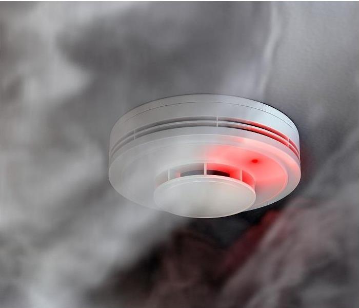 heavy smoke and soot surrounding fire detector